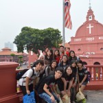 Study Trip to Malacca - Kah Meng is in the red T-shirt in front of the flag